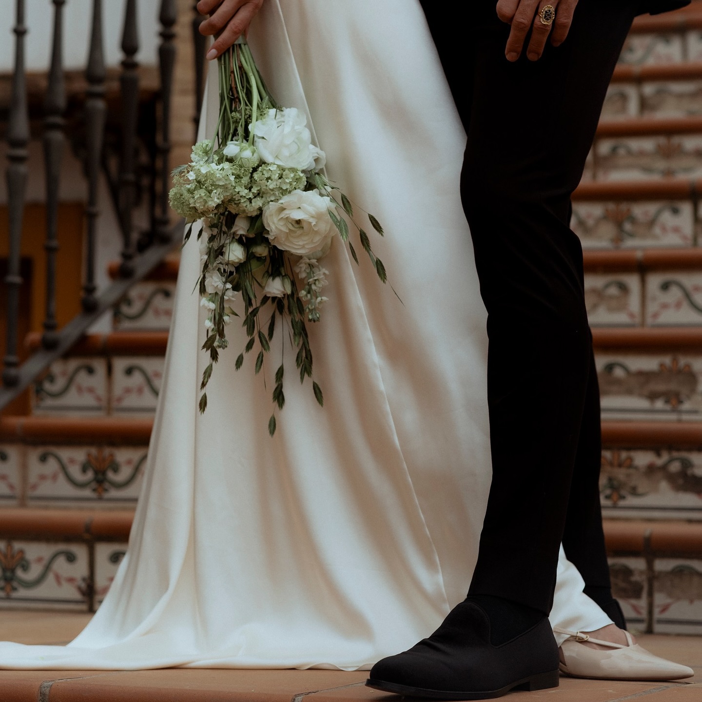 Couple during a photo shoot with an Atelier Anna dress